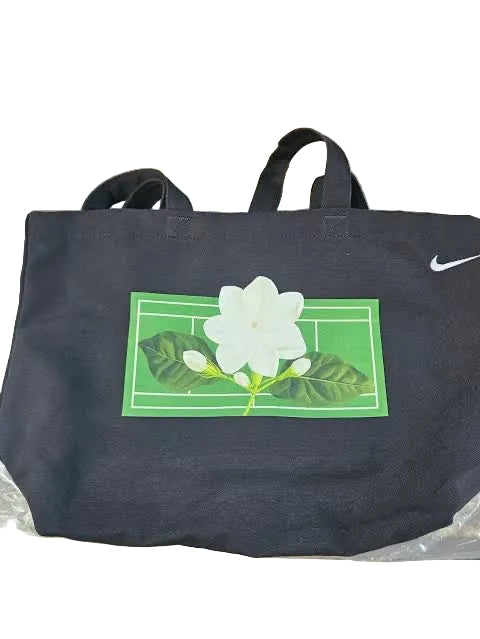 Nike By You x Alex Eala "In Full Bloom" Tote Bag in black, featuring a sampaguita flower graphic and tennis court design